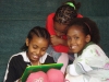 Three young girls utilize the Reading Nook, an area that will become among the most popular areas of the library.