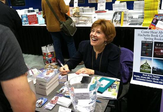 Historical romance author Margaret Mallory signs copies of her new book, <em>The Warrior.</em>