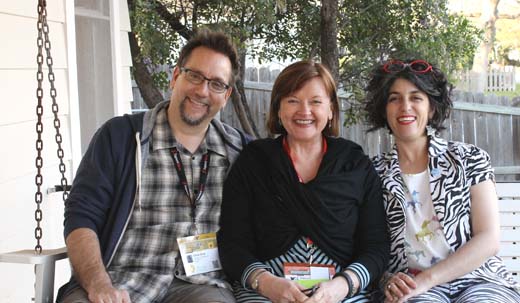 Library technology consultant Carson Block, author Patricia Martin, and librarian Andrea Davis share a porch swing and inspiration outside the IdeaDrop House during SXSW 2013.