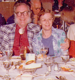 Ruth Freitag, seated with admirer Isaac Asimov on an Astronomical Society cruise