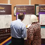 Photo of patrons at Tulsa (Okla.) City–County Library view an immersive exhibit on the 1921 Tulsa race massacre in spring 2021.