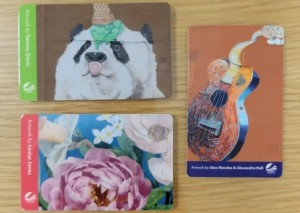 Three Allen County Public Library cards depicting local murals