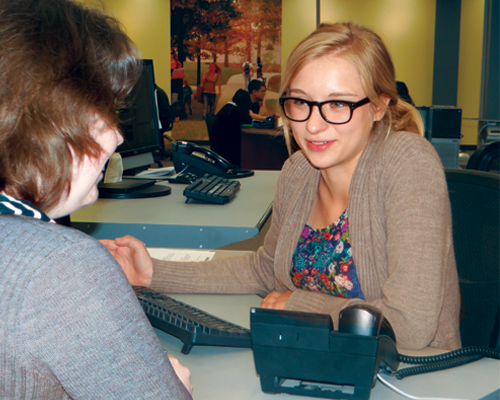 Laura King (right), first-year student in the Information Architecture and Knowledge Management program at Kent State University (KSU), is a graduate student employee in the University Libraries, working both in reserve services and reference.