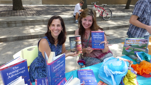 At a meet and greet, Houston LibroFest guest authors Gwendolyn Zepeda and Claudia Kolker show off their award-winning books, The Immigrant Advantage and Better With You Here.