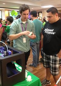 Staff members at Northlake (Ill.) Public Library District seized the opportunity during the September 12, 2013, unveiling of the Hulk statue to highlight equipment purchased with the funds raised, inclduing the 3D printer shown here.