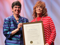 Past President Molly Raphael (left) presents ALA's highest honor to Betty J. Turock (right)