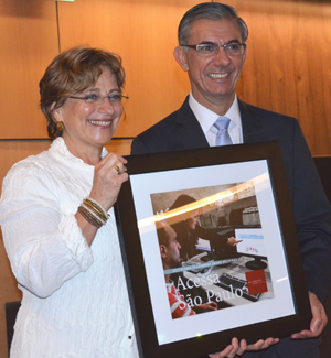 Davi Zaia (right), secretariat of public management for the Saõ Paulo State Government in Brazil, accepts the 2013 Access to Learning Award of $1 million from Deborah Jacobs, director of Global Libraries for the Bill and Melinda Gates Foundation. Photo by Carlon Walker