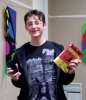 The winner of Boone County(Ky.) Public Library’s Book Bracket contest shows his winnings. 