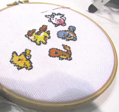 Pokémon creatures march across a cross-stitch sampler created at Detroit Public Library's HYPE Maker Space.