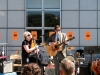 Librarian Penelope Houston (left) from the San Francisco Public Library, known for her work as frontwoman of the punk rock band the Avengers, and her partner, SFPL employee Patricio Johnson, perform a song during a lunchtime music-themed Ban(ne)d Books reading and performance at the Main Library.