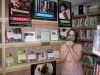 Jessica Herr, head of circulation at Pass Christian (Miss.) Public Library, models bookmarks celebrating the freedom to read in front of a display symbolically cordoned off with a chain and padlock.