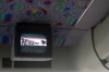 A TV in one of the shuttle buses. The buses are used to get from conference location to another. 