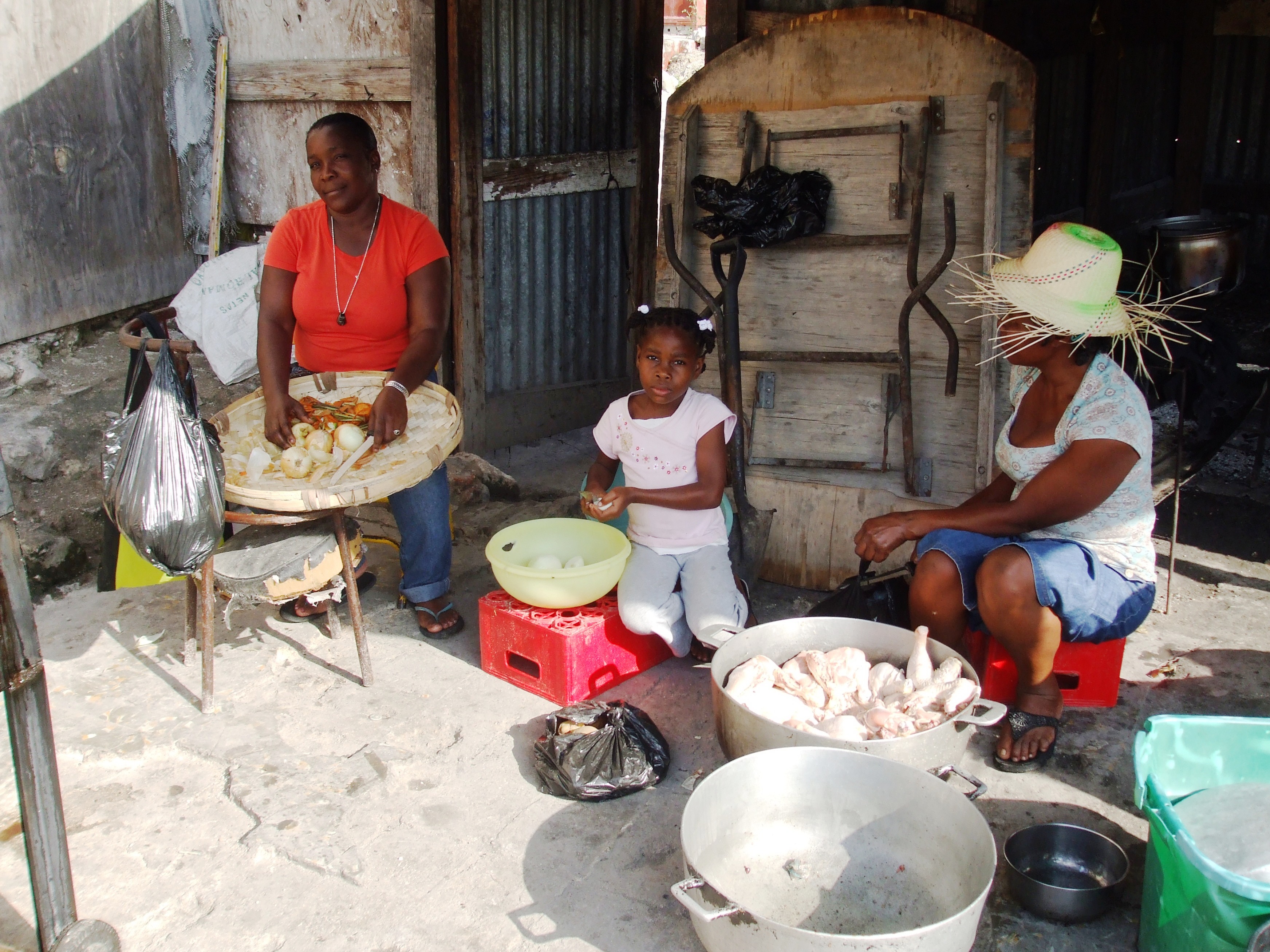 The former site of the public library in Petit-Goâve serves as a backyard kitchen for a family living in a makeshift shelter along the street.