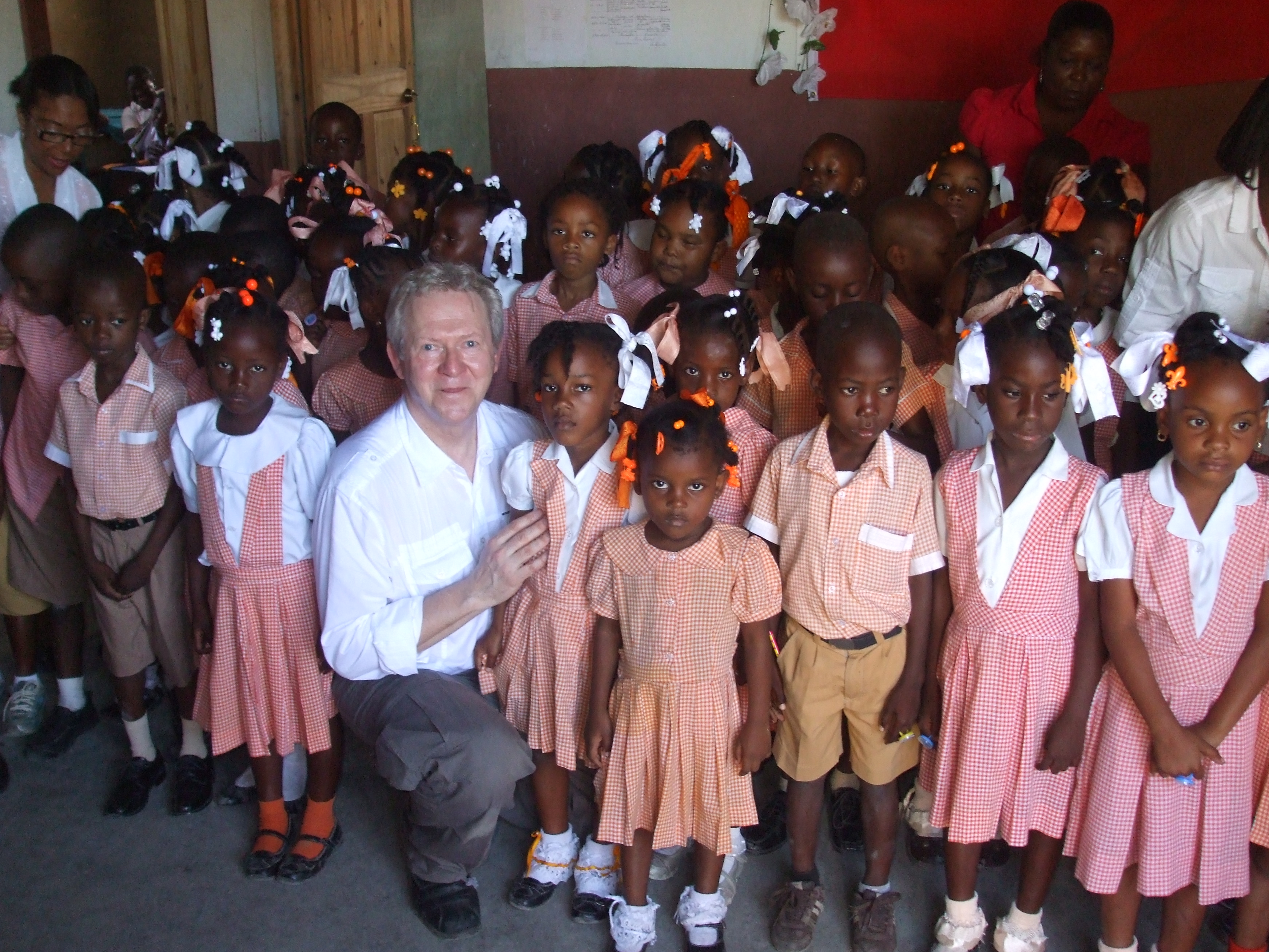 Representing the American Library Association, Leonard Kniffel with kindergarteners in Petit-Goâve following story hour. 