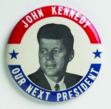 A John F> Kennedy campaign pin.