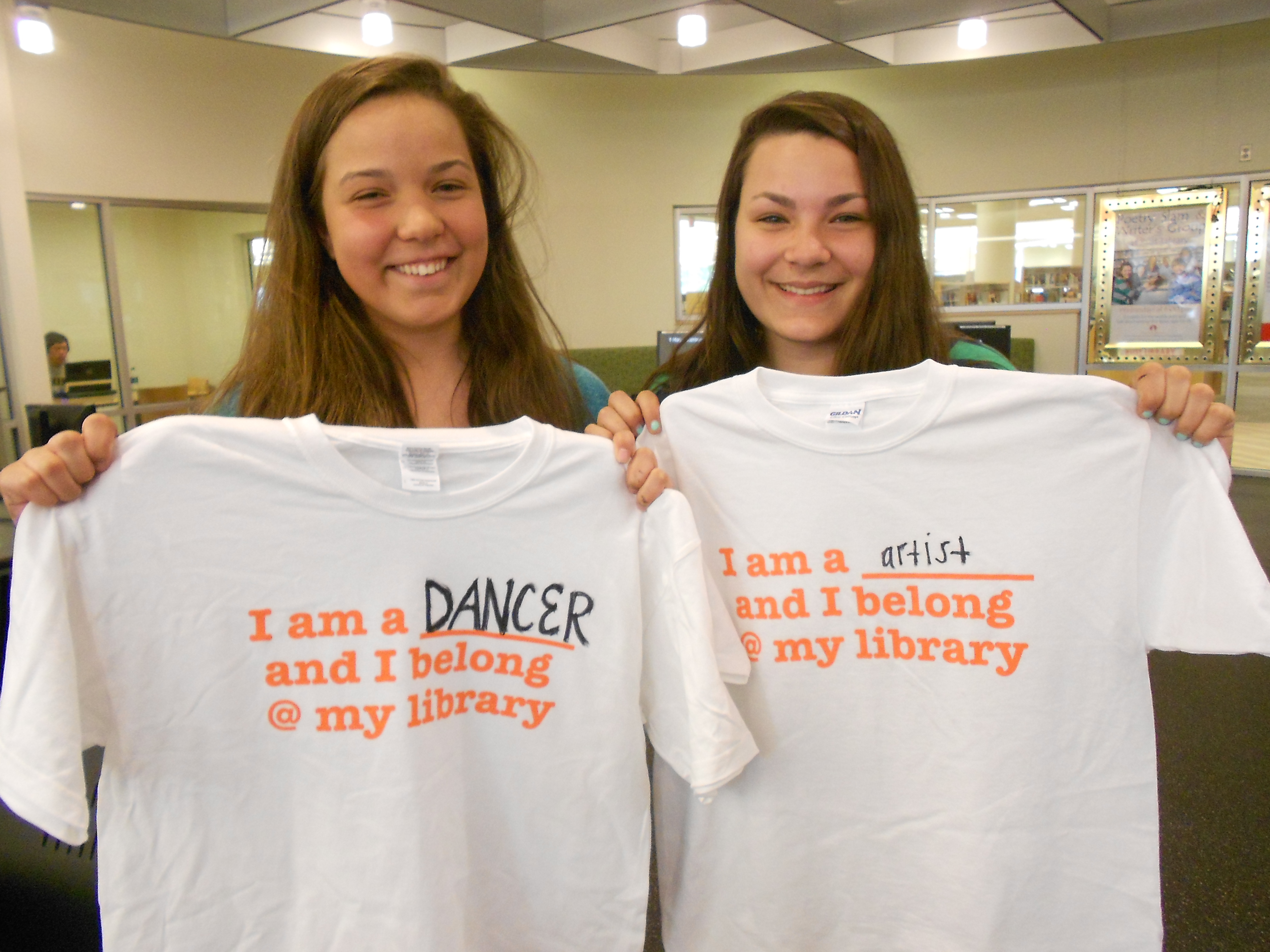 Teens at Loudoun County (Va.) Public Library express their reasons for being library customers on T-shirts that state why they belong at the library.