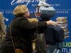 RUSA President Susan Beck gives a hug and air kisses to Oscar T. Robot at the Emery-Pratt booth. 