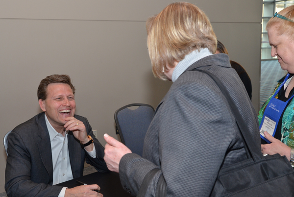 Author David Baldacci shares a laugh while signing books.