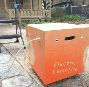 The Electric Campfire, parked outside the O Henry House, is plugged in and ready to charge.