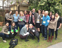 Members of sxswLAM pose with library swag