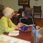 Karen Maki, deputy director of GBPL, with a "traveler" who is participating in the Tales and Travels program.