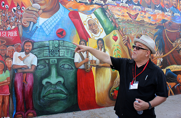 Alberto Pulido, professor and chair of the department of ethnic studies at the University of San Diego, gives a tour of Chicano Park in San Diego’s Logan Heights community during the fifth Reforma conference. The park, which is celebrating its 45-year history, is home to the country’s largest collection of outdoor murals.