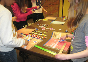 Members of Bridgewater Library's tween advisory group work at a crafting table.