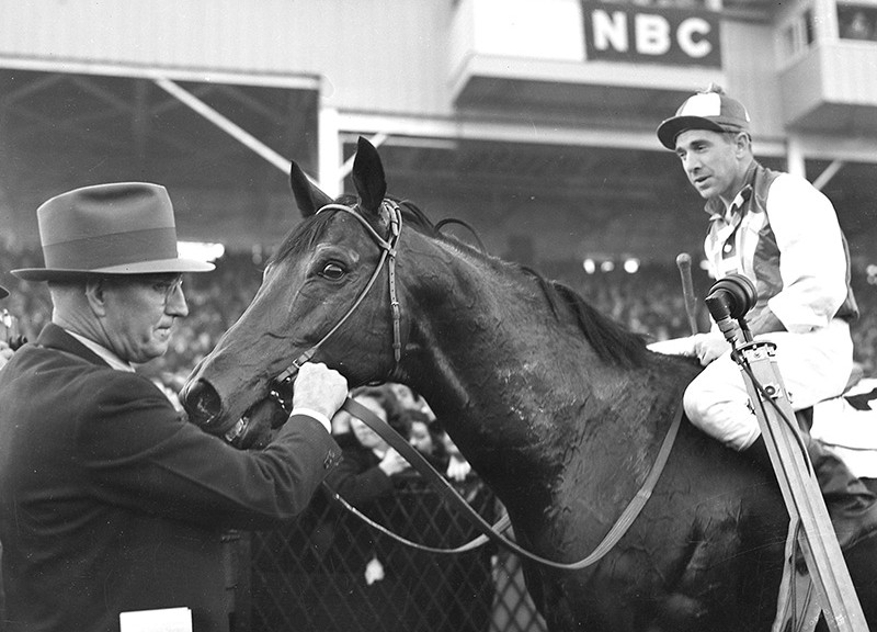 Seabiscuit with jockey George Woolf and trainer Tom Smith after winning the Pimlico Special, November 1, 1938. (Photo: Keeneland Library)