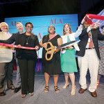 Past President Courtney L. Young cuts the ribbon after the Opening General Session on June 26.