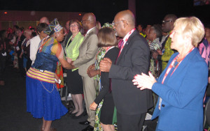 Storyteller Gcina Mhlophe (left) dances with delegates.