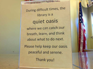 A sign in the Ferguson Municipal Public Library during last year's unrest.