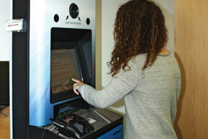 A patron renews her driver’s license inside Ames (Iowa) Public Library in June. Iowa DOT unveiled 11 kiosks in libraries in May.