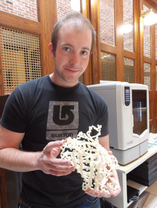UNR biotechnology graduate student Jackson Gratwohl shows the first 3D-printed model of a green fluorescent protein structure he created by converting a protein database file into a 3D-printable format. 