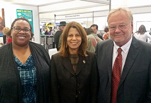 (left to right) ALA Past President Courtney Young, current ALA President Sari Feldman, and ALA Executive Director Keith Michael Fiels in the WLIC exhibits hall. Photo: George M. Eberhart 