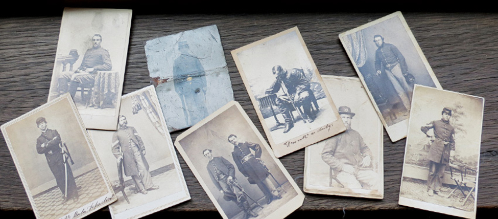 A few of the 75 Civil War–era photographs that were taken from Bangor (Maine) Public Library and later recovered. These images, along with 50 original World War I– and World War II–era posters that were stolen, had an estimated value of $31,000. The image of the officer leaning over his chair helped identify the set as belonging to the library.