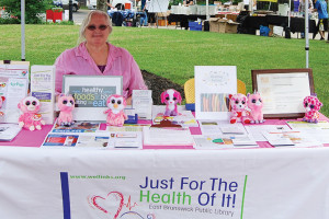 East Brunswick (N.J.) Public Library Consumer Health Librarian Catherine Adamo explains “Just for the Health of It” at a farmers market. 
