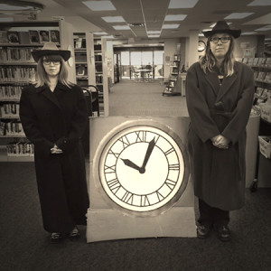 At Jefferson County (Colo.) Public Library, patron experience associate Lindsay Masciotti (left) and patron experience supervisor Kelly Duran pose with a replica of the clock tower featured in the <i>Back to the Future</i> films. <span class="credit">Photo: Jefferson County Public Library</span>