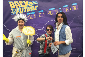 Salt Lake City Public Library System staffers pose as characters from the Back to the Future films. From left, teen services coordinator Christina Walsh as Doc Brown, children's services coordinator Liesl Johnson as Marty McFly, and adult services coordinator Tommy Hamby as Jennifer Parker. Photo: Salt Lake City Public Library System