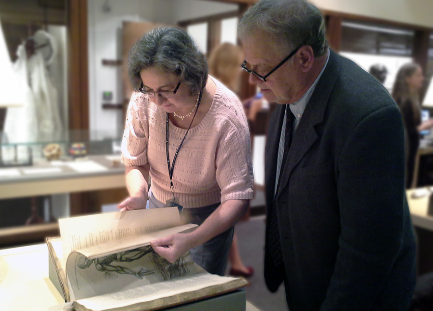 Lilla Vekerdy, head of special collections at Smithsonian Libraries, shows an anatomy book to ALA Executive Director Keith Michael Fiels.