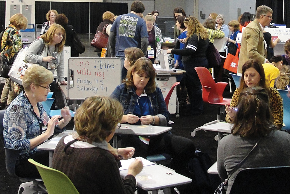 An AASL makerspace in the exhibit hall attracted attendees to work with littleBits electronic building blocks and create lighted name badges and low-tech maker crafts.