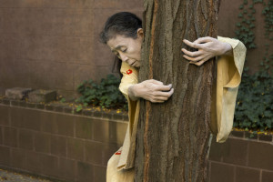 Eiko Otake began her performance in the courtyard of Russell Library. For her, the tree was a connection to the material of the books in the library. Photo: William Johnston