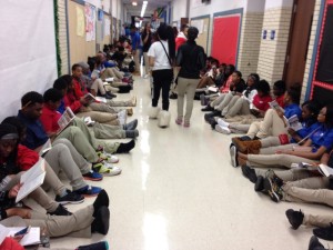 Students stage a "read-in" in the school's hallways to protest the closing of the library.