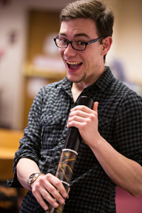 A satisfied patron has just tried out the didgeridoo at the world music instrument exposition during Wartburg College’s Research, Internship, and Creative Endeavor (RICE) Day, 2014.