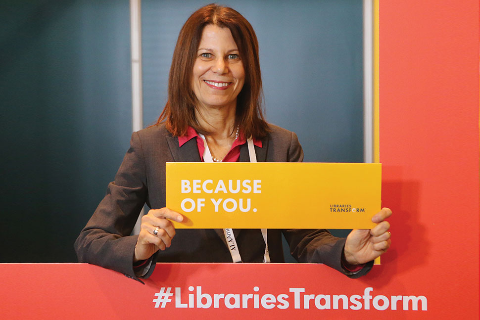 ALA President Sari Feldman stopped by the photo booth in the ALA Lounge at Midwinter to show her support of the Libraries Transform campaign. Photo: Cognotes