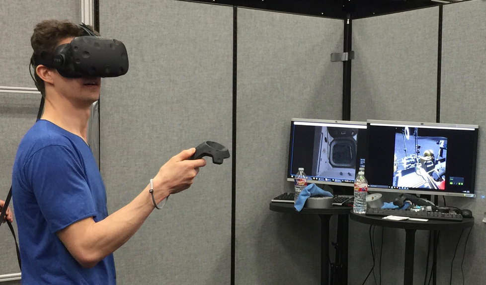 A user in the NASA booth takes a virtual tour of Mars at SXSWi in Austin, Texas.