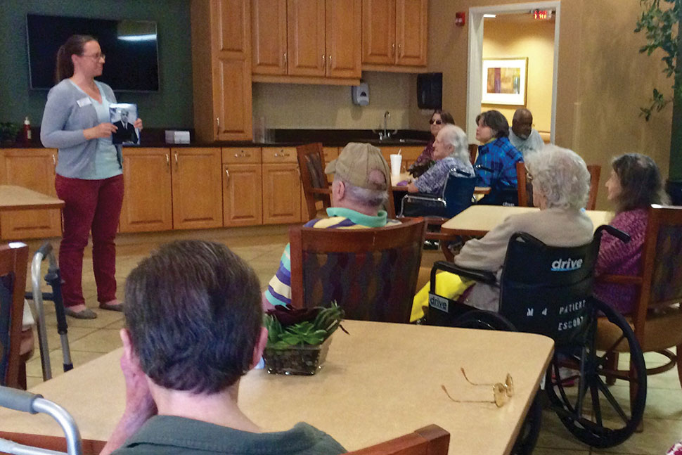 Marie Corbitt, outreach program librarian at Westerville (Ohio) Public Library, leads a “Remember When” storytime at a nursing facility. Photo: Westerville (Ohio) Public Library