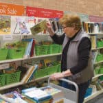 Kathy Clay, president of the Waukegan Public Library’s Friends of the Library, restocks children’s book for an upcoming book sale. Photo: Rebecca Lomax/American Libraries
