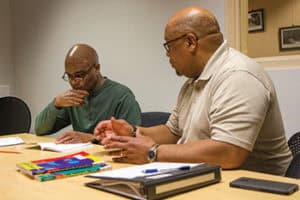 Louie Summers Jr. (right) tutors as part of Waukegan (Ill.) Public Library’s adult literacy tutoring program; Photo: Rebecca Lomax/American Libraries