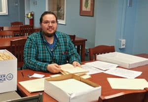 Nicholas Mason, an undergraduate at University of North Carolina at Greensboro, processes a manuscript collection at Jackson Library. Photo: Kathelene Smith