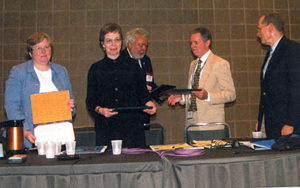 Library Connection librarians (The Connecticut Four) receive the Robert Downs Award from ALA President Michael Gorman at the 2006 ALA Annual Conference in New Orleans. From left: Barbara Bailey, Janet Nocek, ALA President Gorman, Peter Chase, George Christian. Photo by George Eberhart